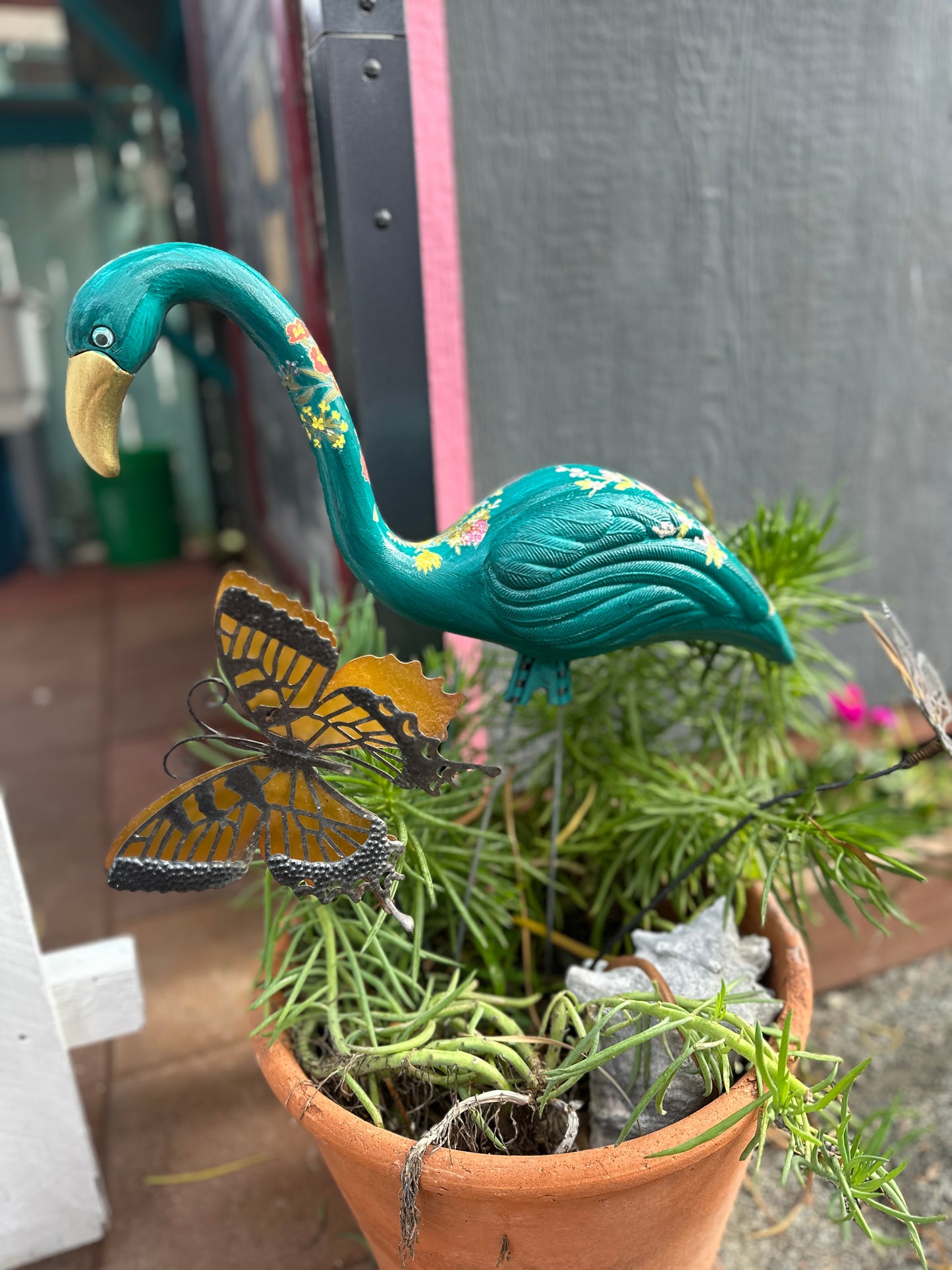 hand painted plastic thrifted flamingoes