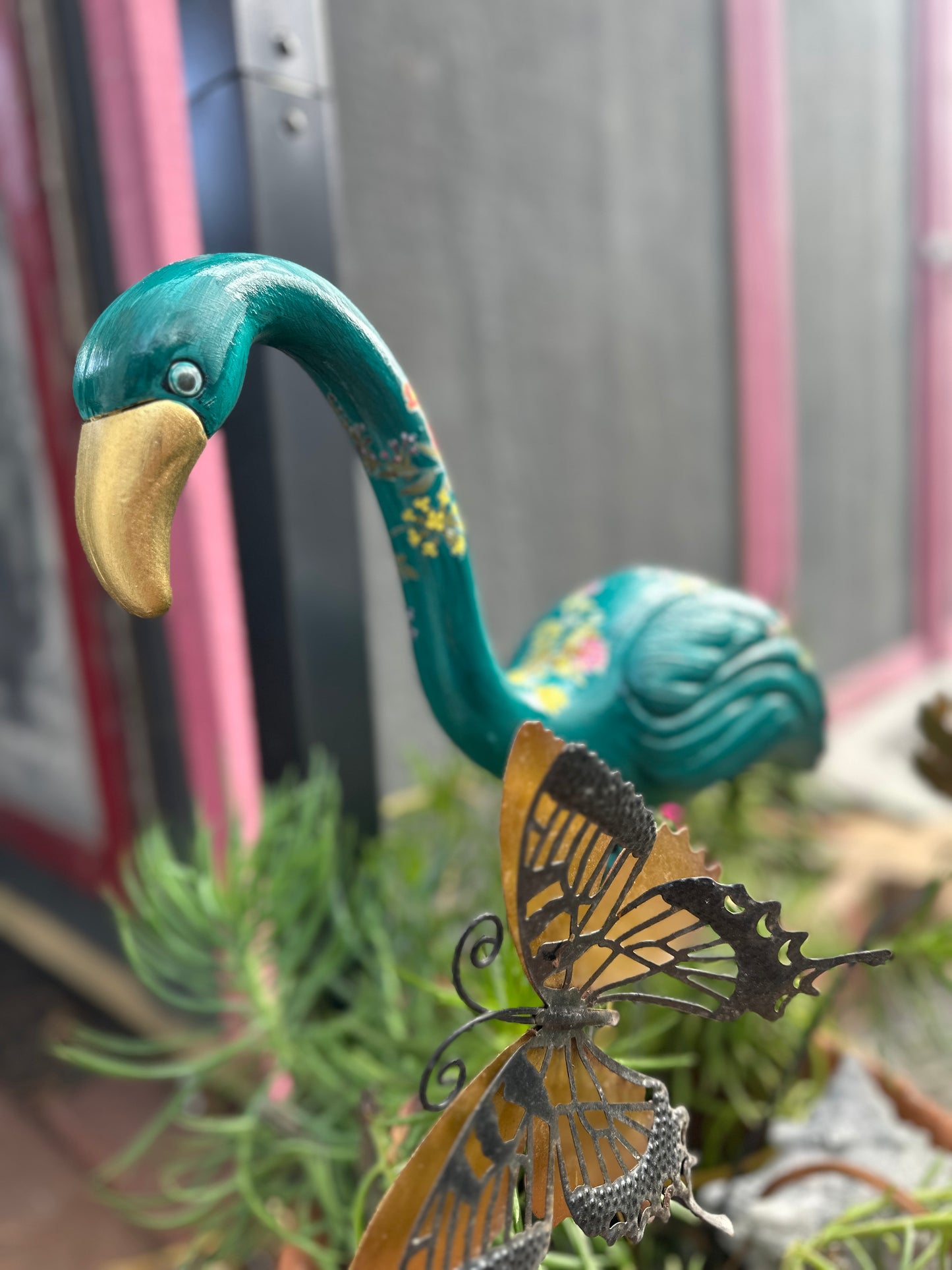 hand painted plastic thrifted flamingoes
