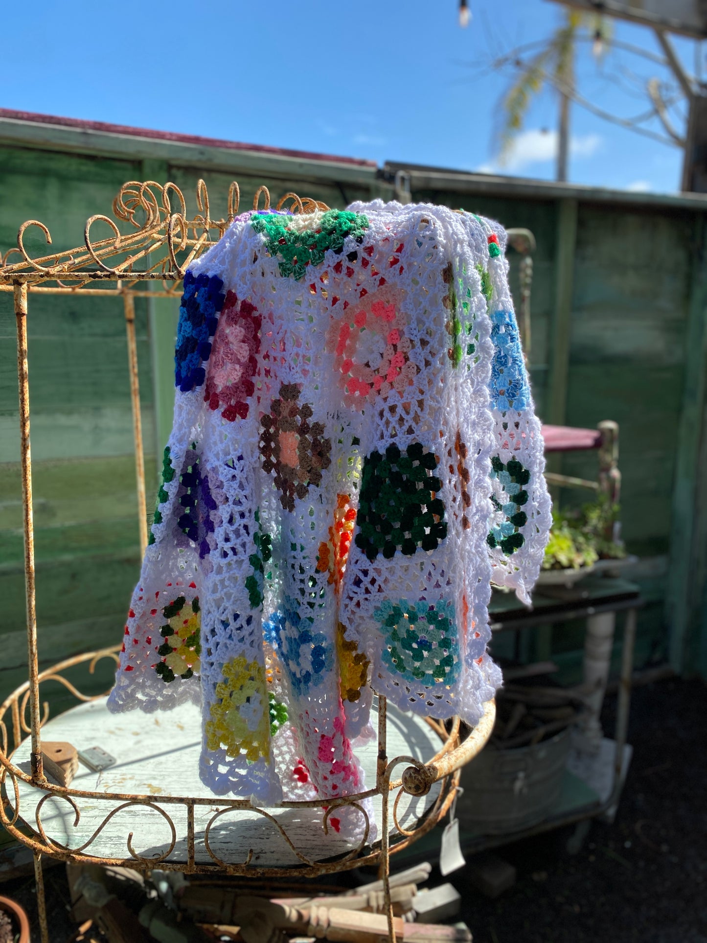 Colorful and White granny square afghan