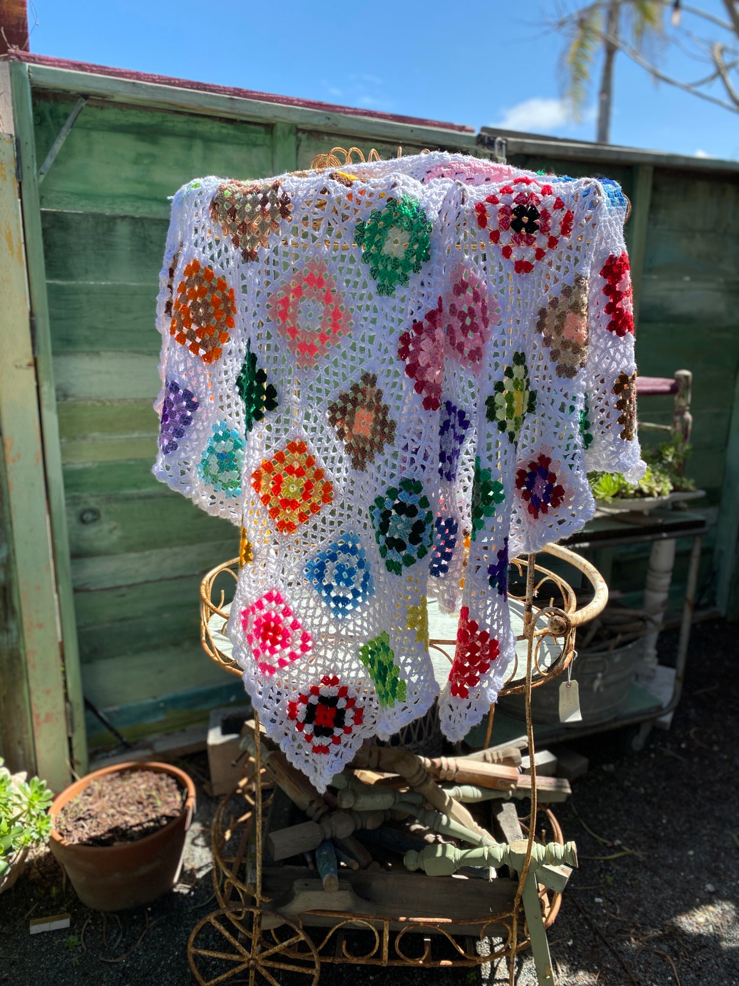 Colorful and White granny square afghan