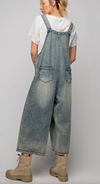 Loose fit , faded , distressed overalls