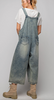 Loose fit , faded , distressed overalls